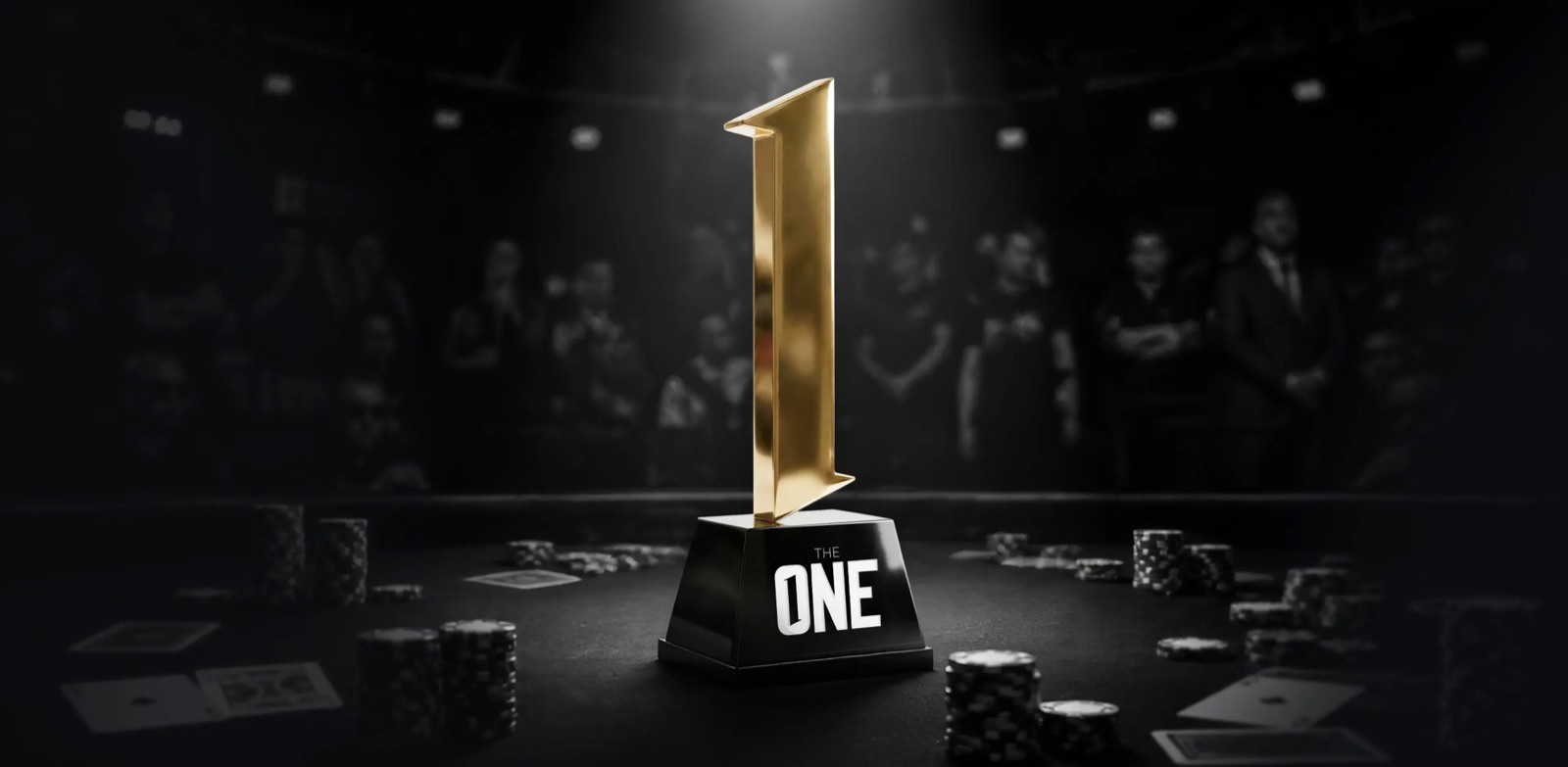 CoinPoker's The One trophy on the felt among chips and cards